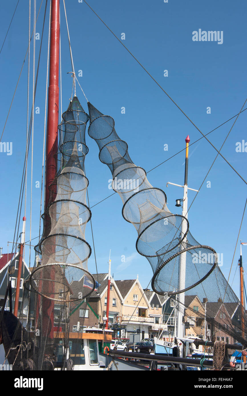 Drying fishing nets on boat in small fishing harbour in Urk, Flevoland, Netherlands Stock Photo