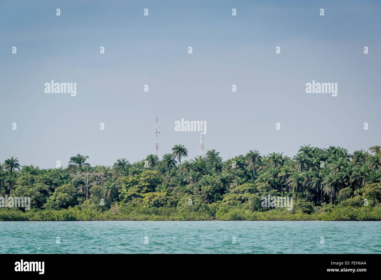Mobile phone masts among the tropical forests of the Bijagos islands, Guinea Bissau Stock Photo