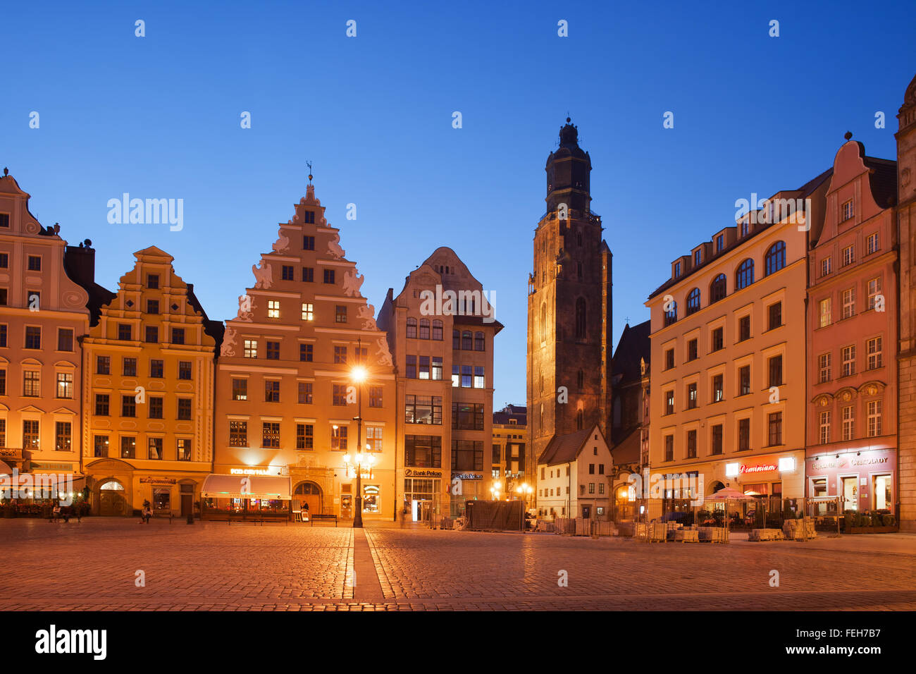 City of Wroclaw in Poland, Old Town skyline at dusk, tower of St. Elizabeth Church, historic tenement houses with gables Stock Photo