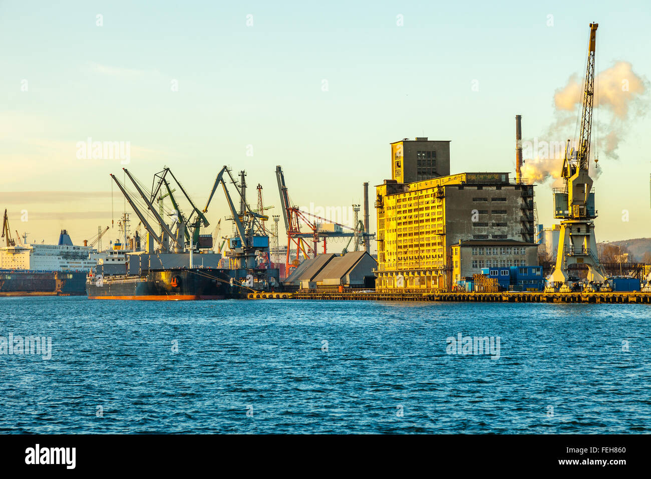 Cargo ship in the morning light on port of Gdansk, Poland Stock Photo