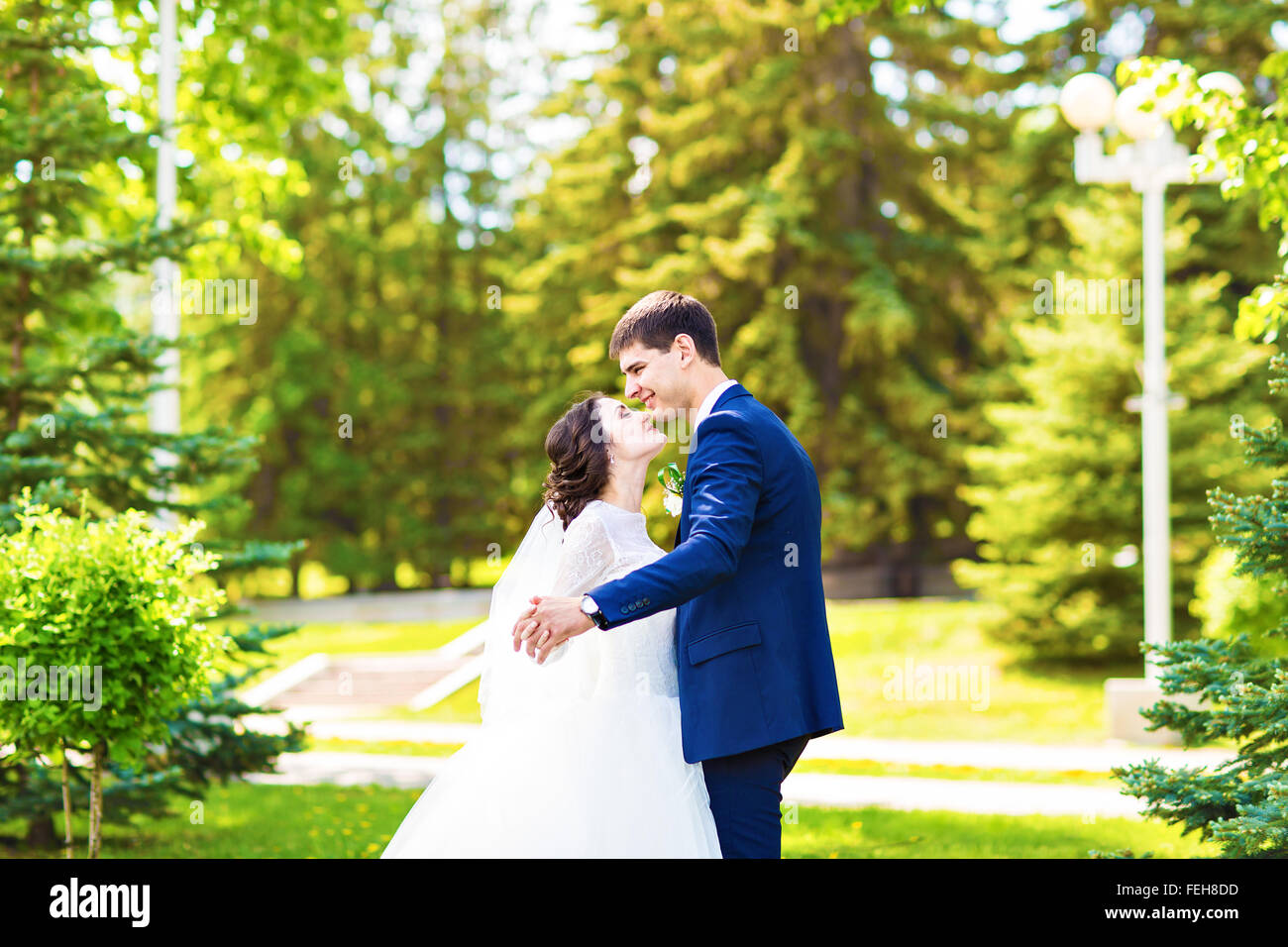 Happy bride and groom on their wedding day Stock Photo - Alamy