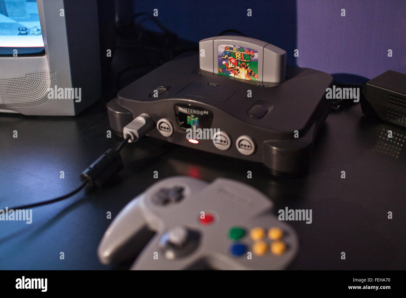 Nintendo N64 console with Super Mario computer game inserted on