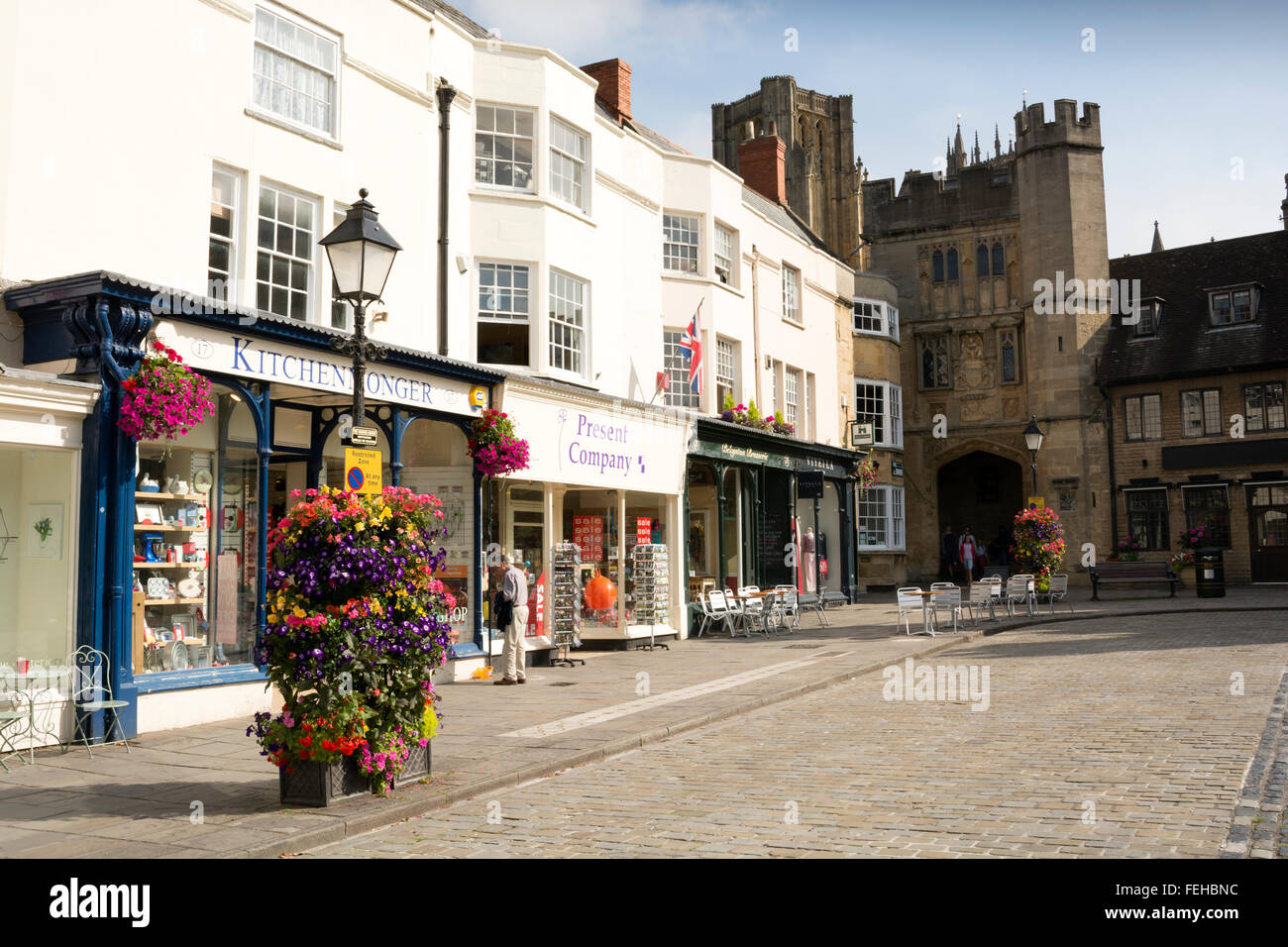 The Market Place in Wells, Somerset, UK showing the rows of shops, the