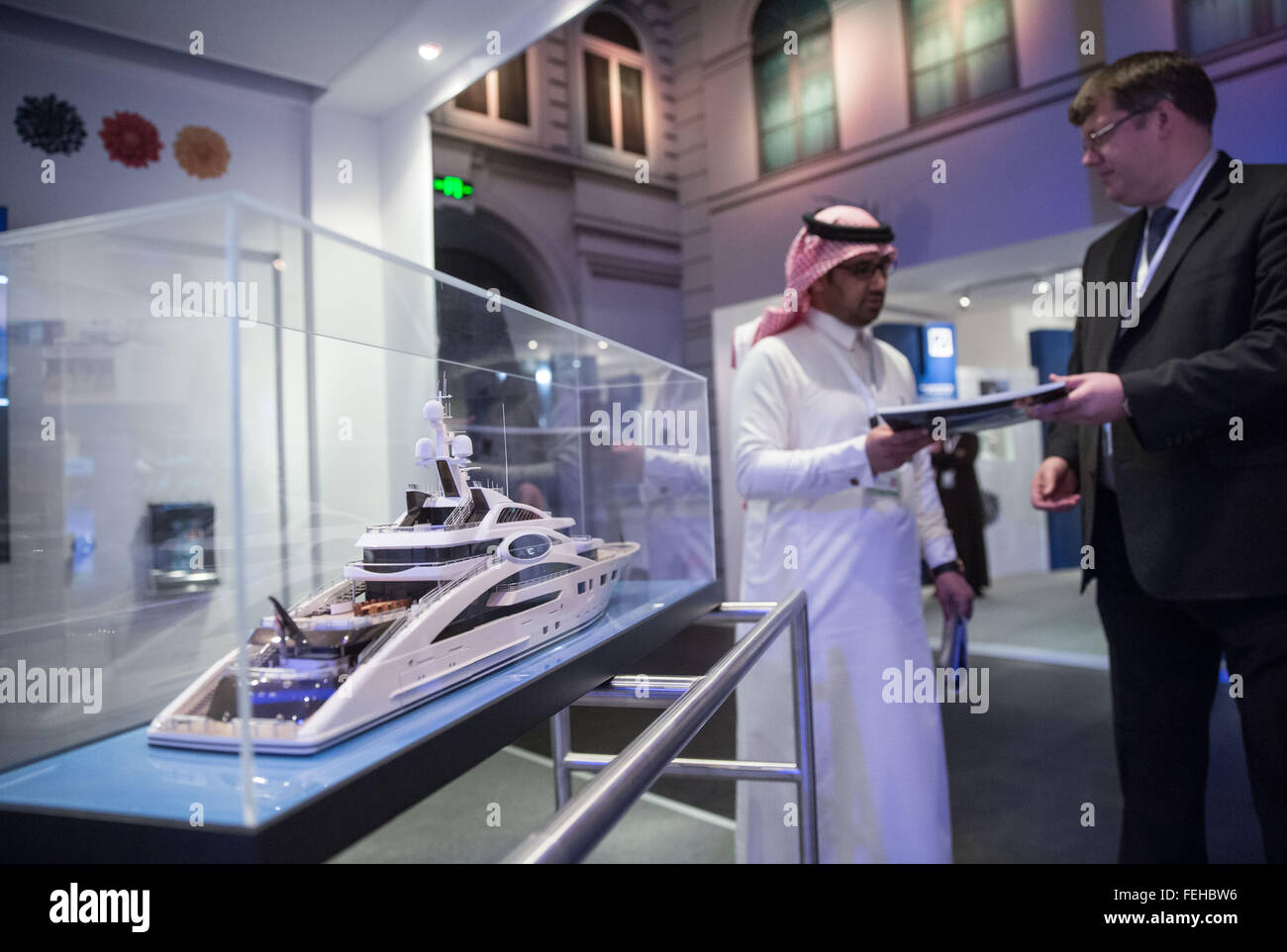 Riad, Saudi Arabia. 03rd Feb, 2016. A man takes a leaflet at the booth of the Luerssen shipyard in the German pavilion at the Al-Jenadriyah festival in Riad, Saudi Arabia, 03 February 2016. Germany is a guest country at the two-week cultural and heritage festival in Jenadriyah near Riad. Photo: MICHAEL KAPPELER/dpa/Alamy Live News Stock Photo
