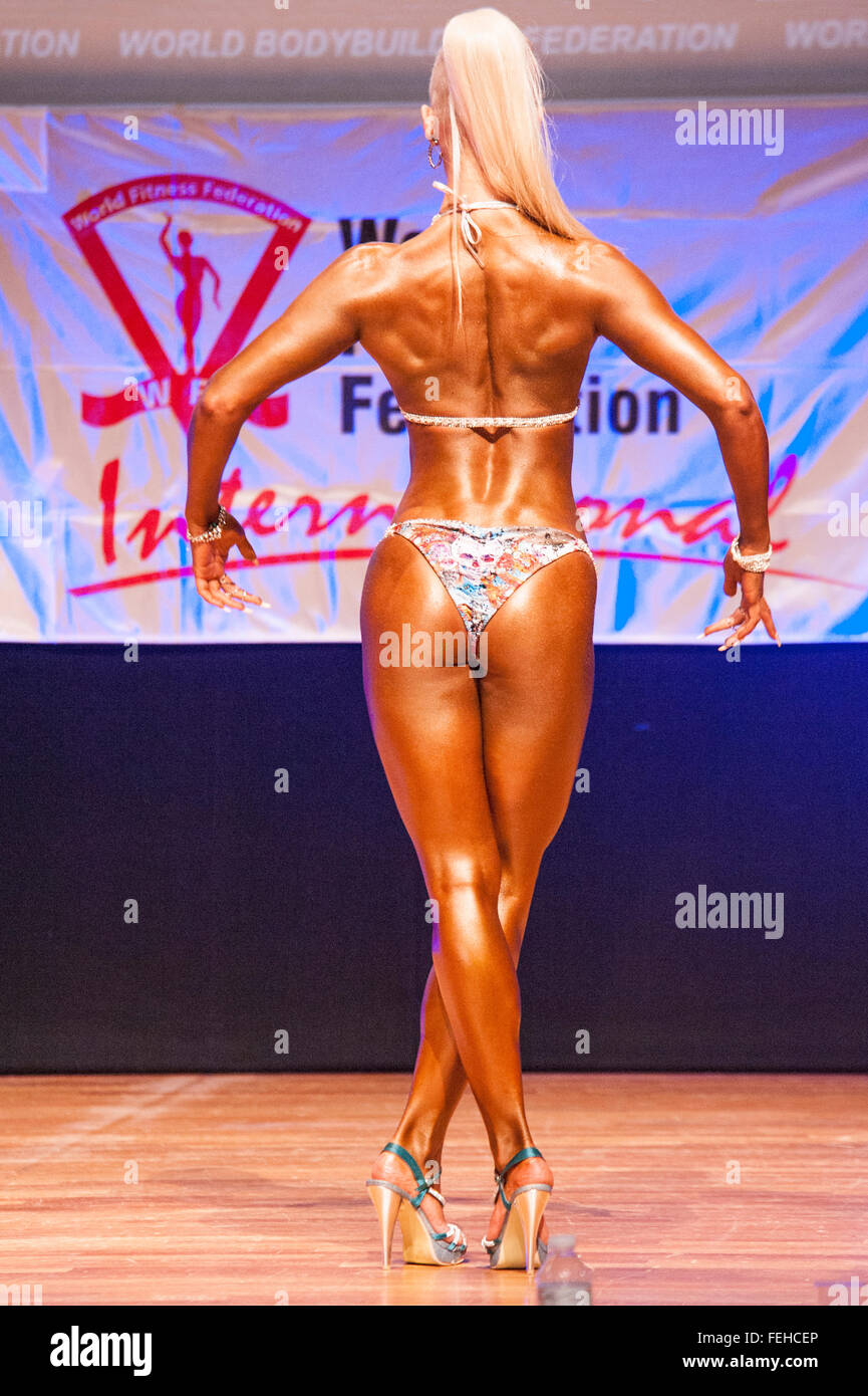 Female Bodybuilder in Red Bikini Performing on Stage Editorial Stock Image  - Image of medal, flexing: 62859459