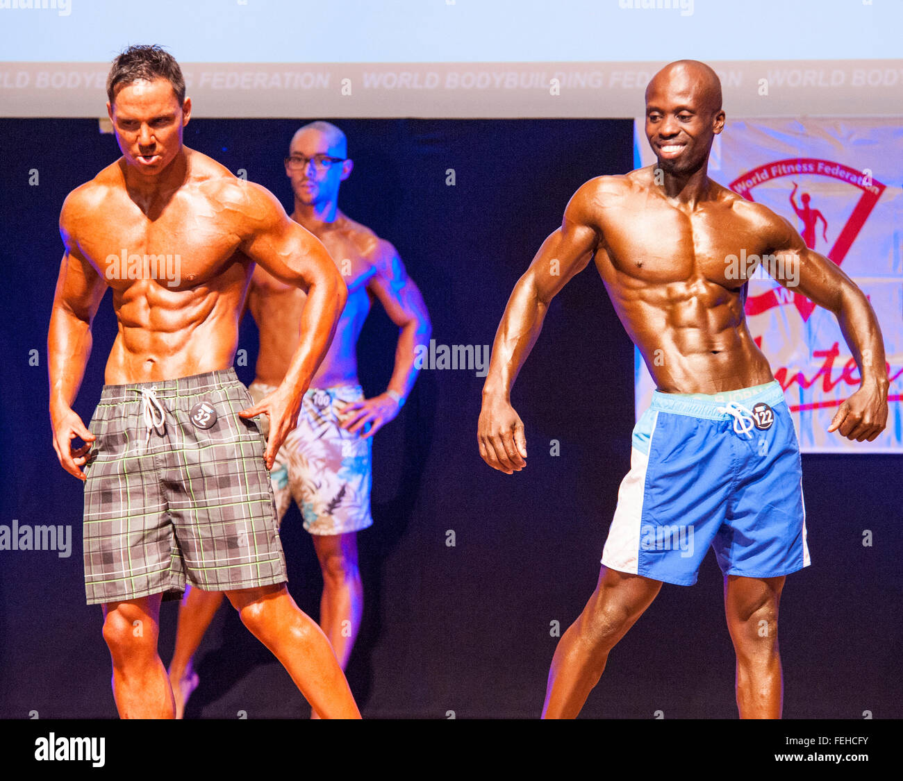 MAASTRICHT, THE NETHERLANDS - OCTOBER 25, 2015: Male physique model John Black and other competitiors show their best side pose Stock Photo