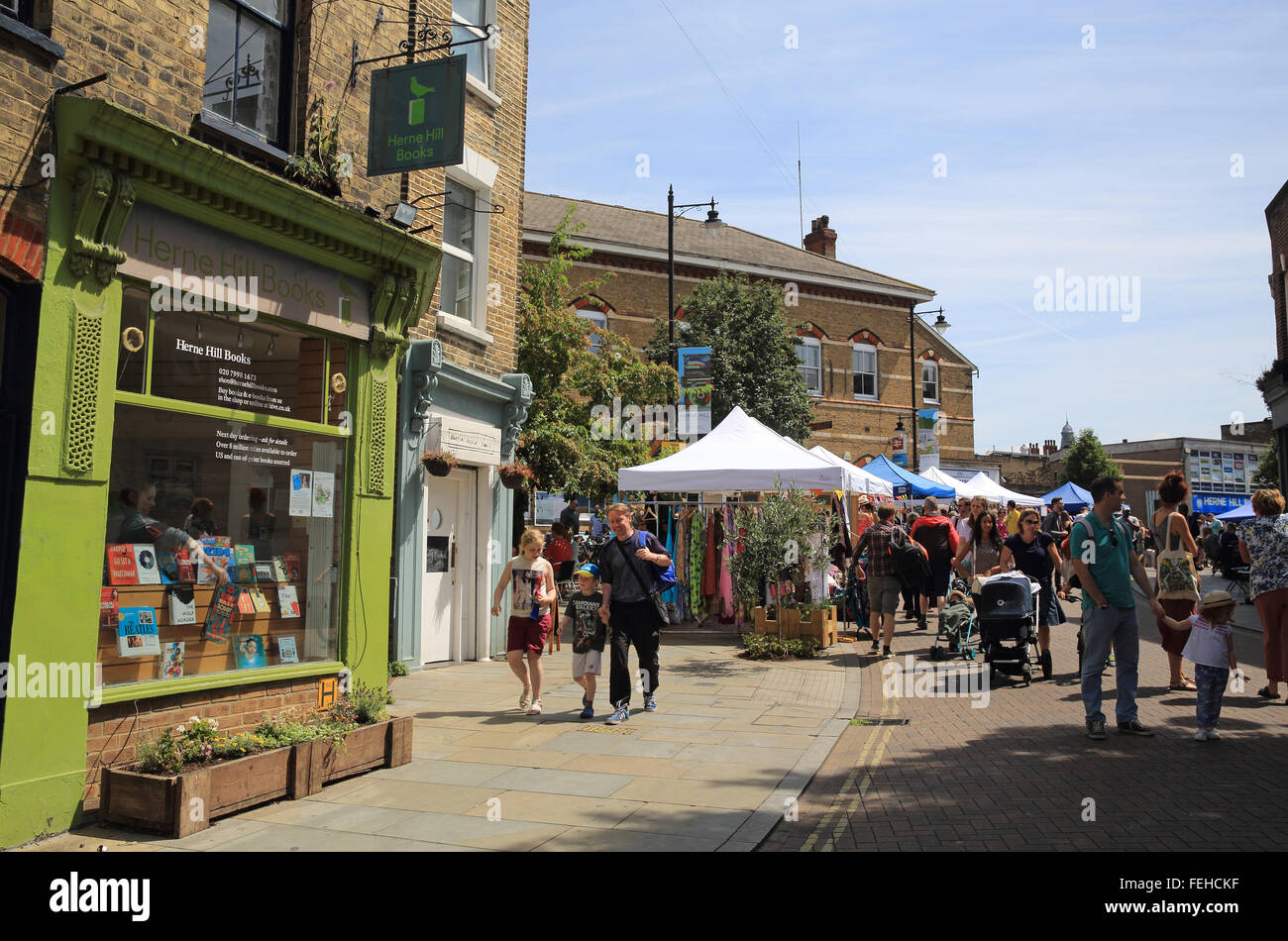 Shops and the popular Saturday market on Railton Road, in Herne Hill, SE London, England, UK Stock Photo