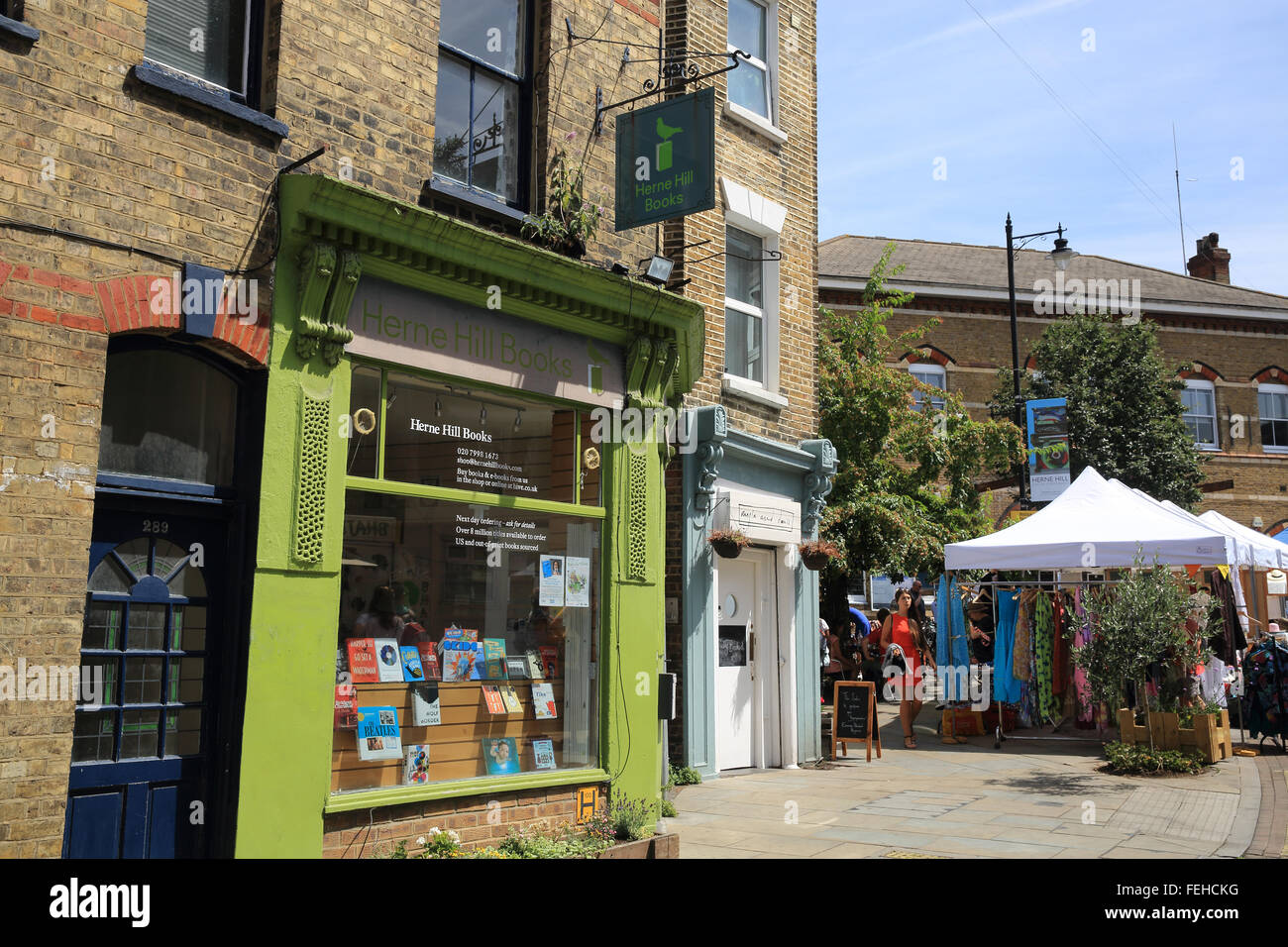 Local shops and the Saturday market on Railton Road, in upmarket Herne Hill, SE London, England, UK Stock Photo