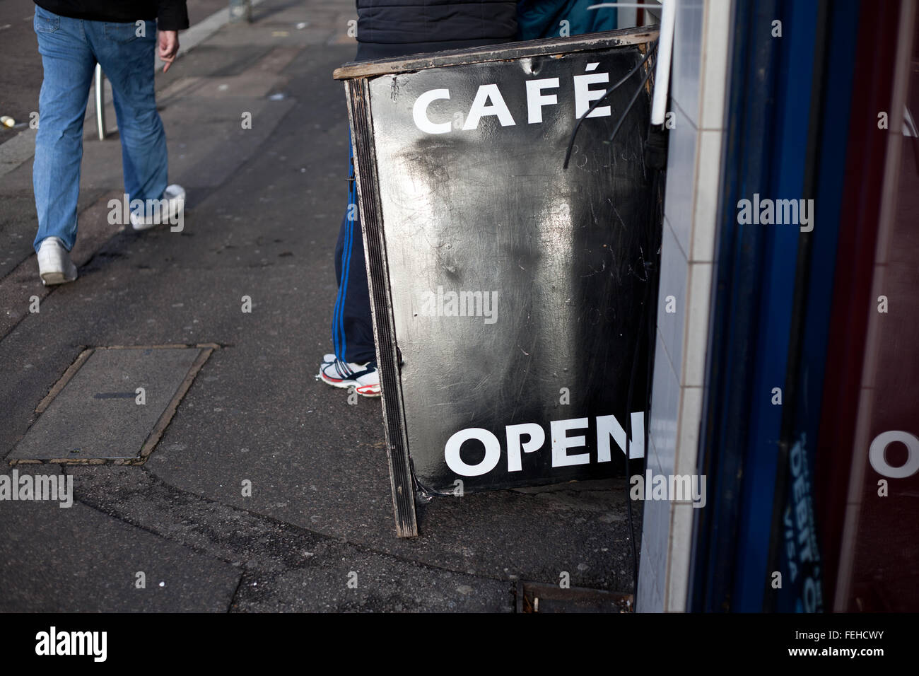 Black 'Café Open' sign on pavement of London street. Stock Photo