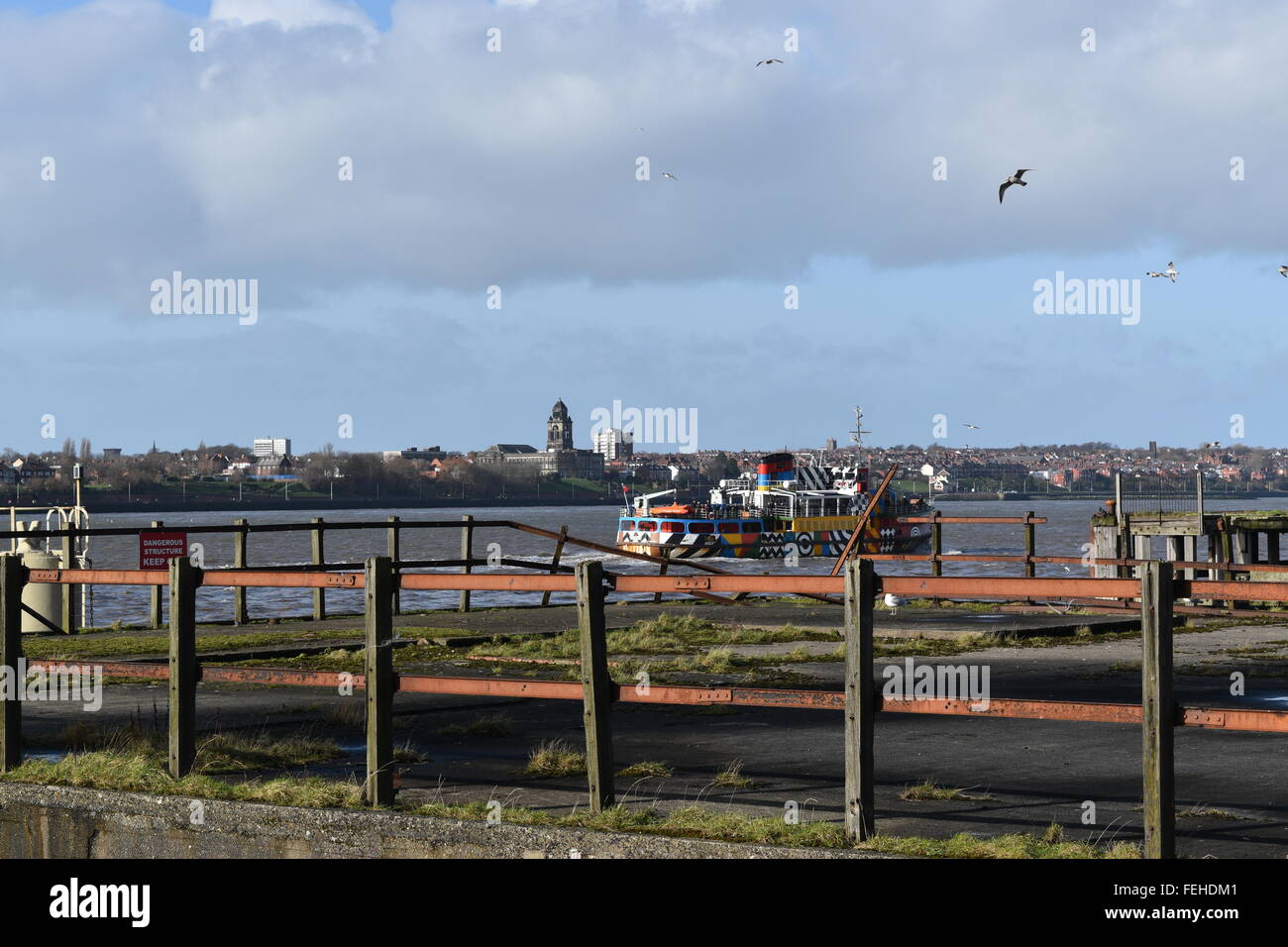 Liverpool waterfront with Mersey Ferry looking towards Wallasey. Domed Wallasey Town Hall on the skyline. Stock Photo