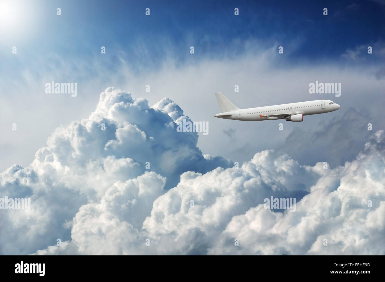 Plane flying through dramatic storm clouds Stock Photo - Alamy