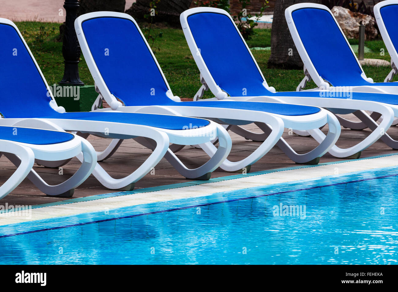 lounge chairs by the pool Stock Photo Alamy
