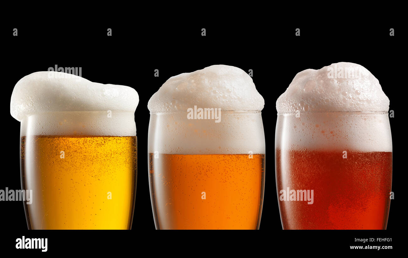 Different beer in glasses isolated on black Stock Photo Alamy