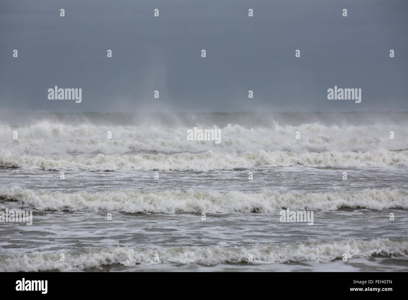 Northumberland, UK. 7th February, 2016. UK Weather: Waves in the North Sea off Northumberland, England. Waves with whitecaps break next to the beach. Credit:  Stuart Forster/Alamy Live News Stock Photo