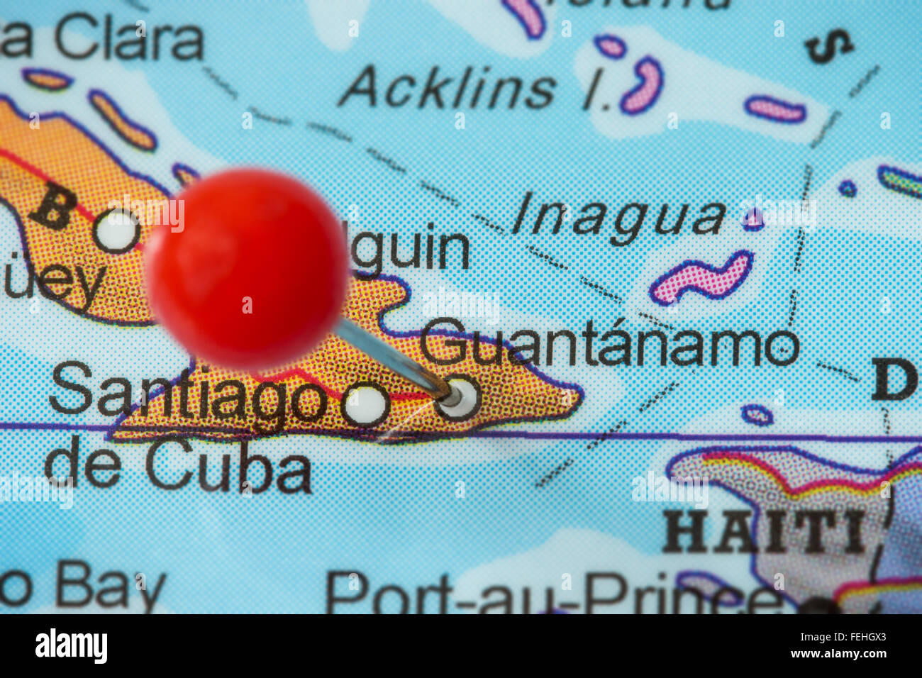 Close-up of a red pushpin in a map of Guantanamo, Cuba. Stock Photo