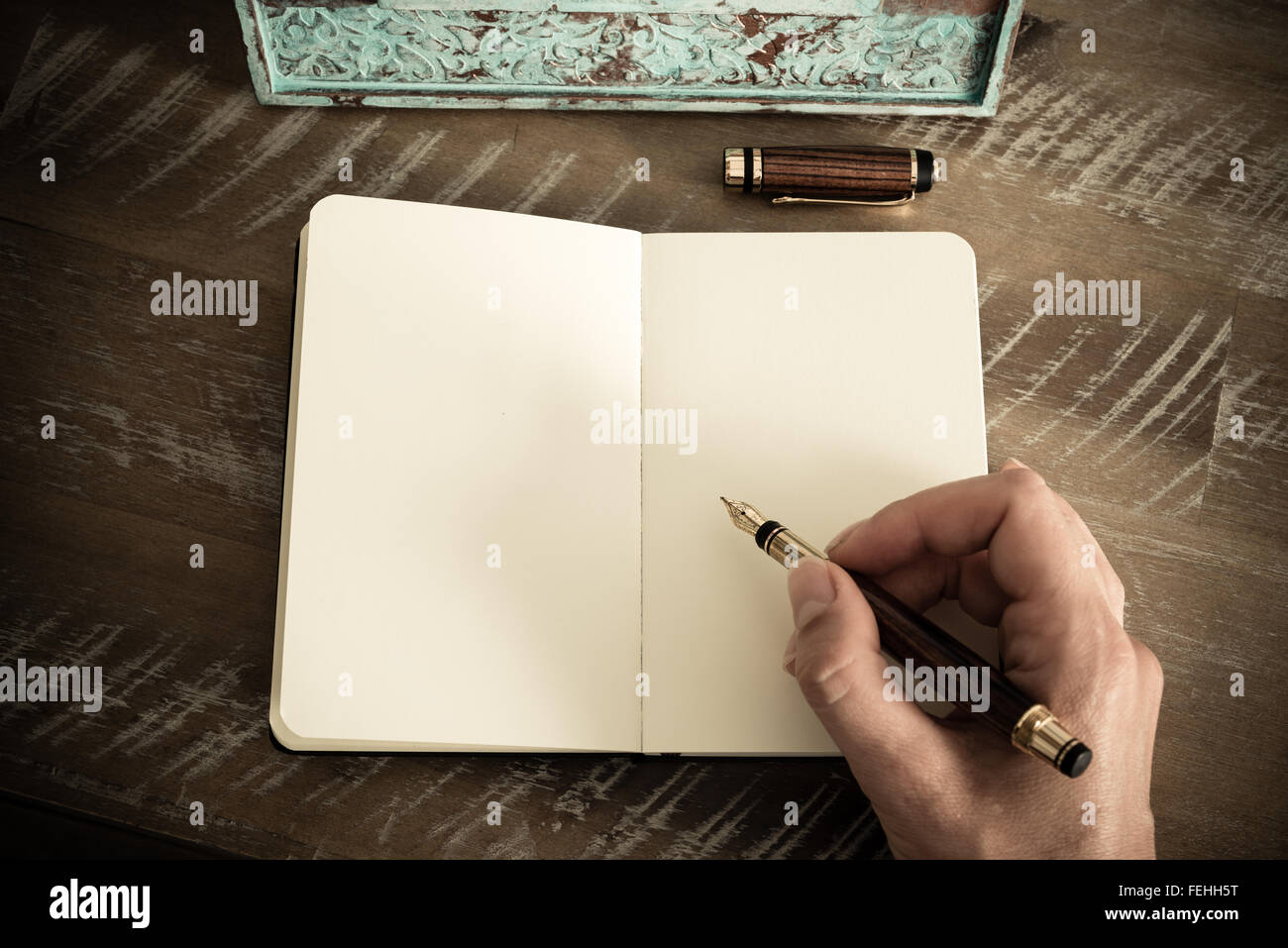 Writing Note Classic Retro effect and toned image of a woman hand writing a note with a ...