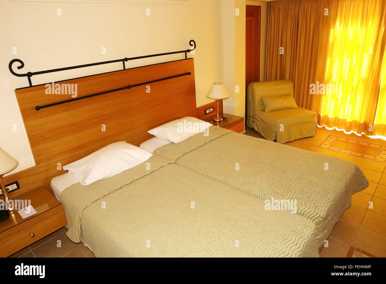 Room interior with bads in high class greek hotel Aldemar Royal Mare