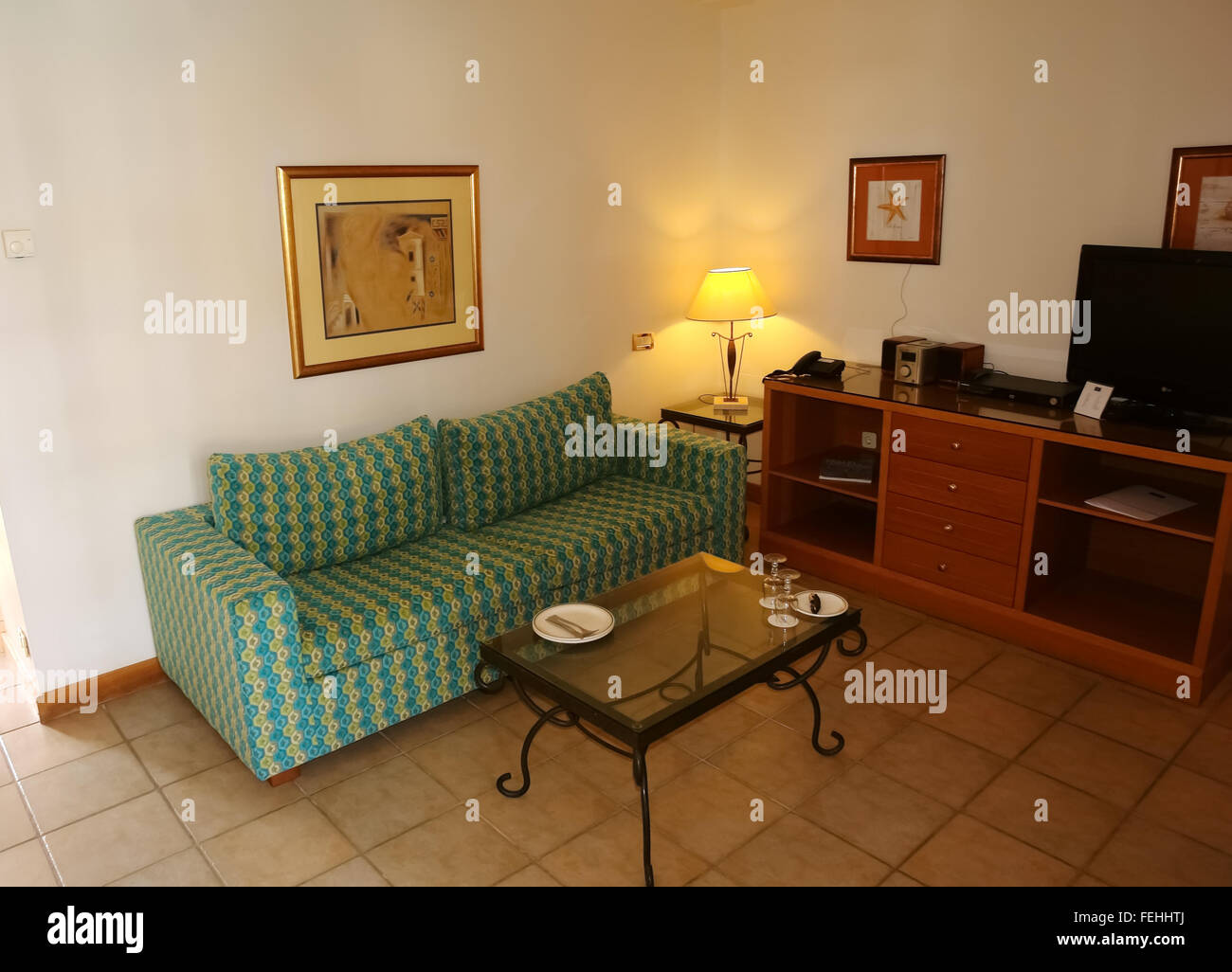 Crete Island, GREECE - MAY 11, 2014:  Room interior with table and bad in high class greek hotel Aldemar Royal Mare, Crete islan Stock Photo