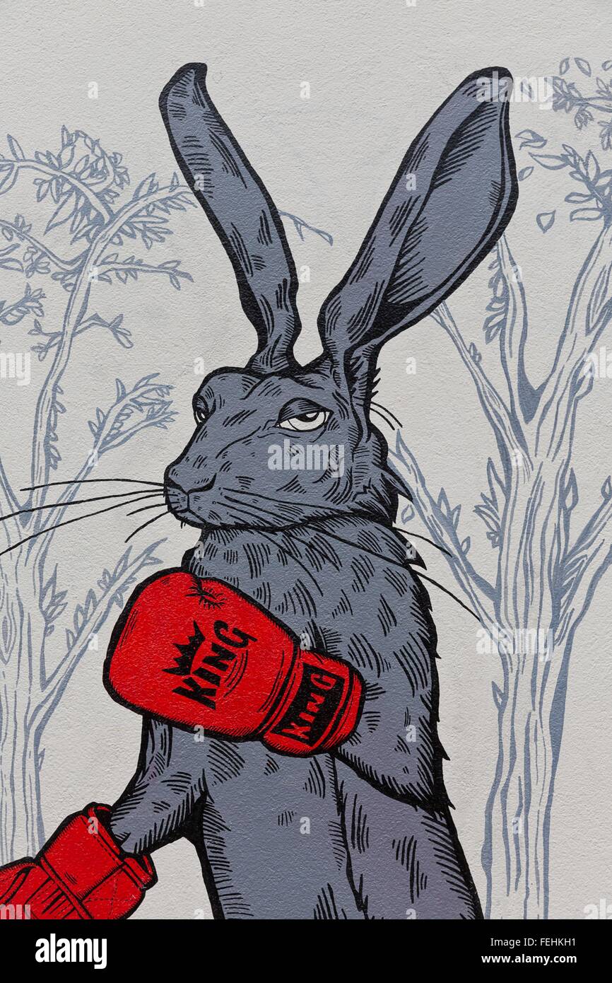 April 2014 - Bristol, United Kingdom: A graffiti of a grey boxing rabbit with red boxing gloves 'King' Stock Photo