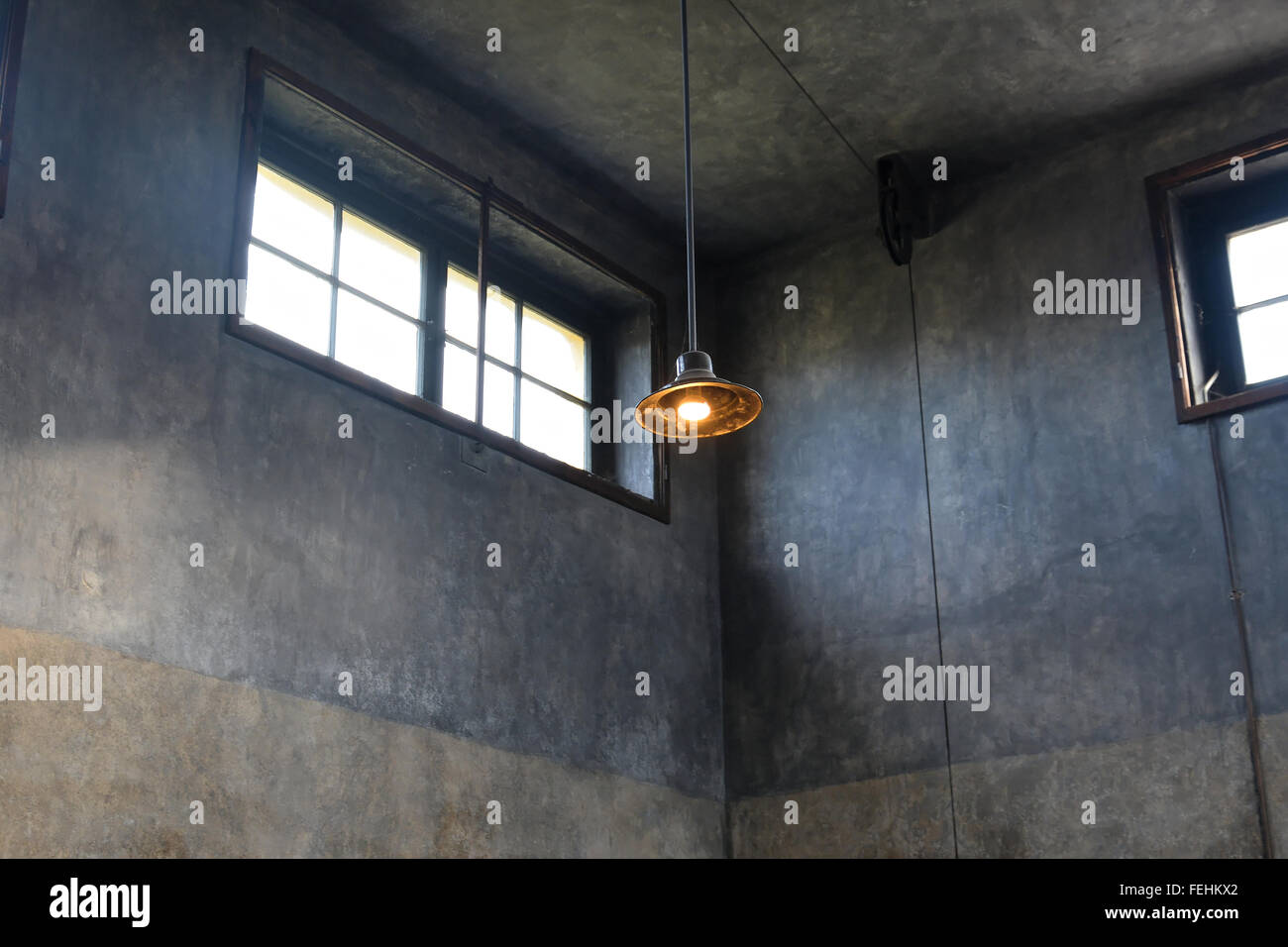 A solitary light in the Crematorium at the Terezin concentration camp in the Czech Republic. Stock Photo
