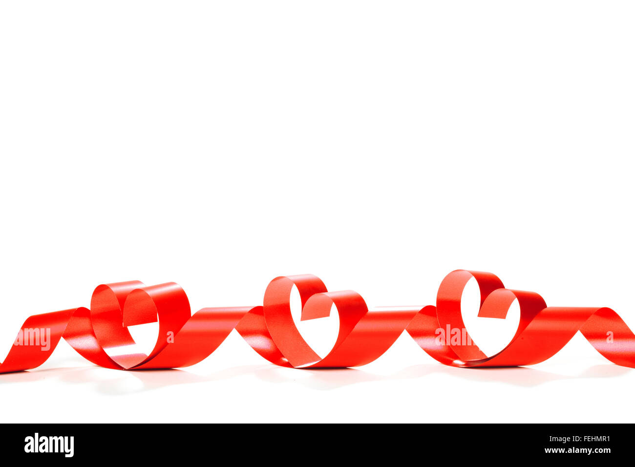 red heart ribbon isolated on white background Stock Photo - Alamy