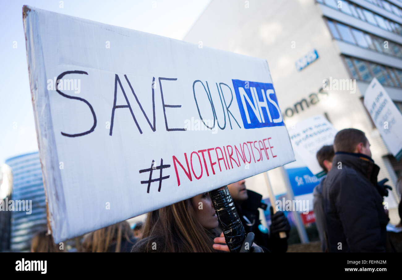 UNITED KINGDOM, London: 12 January 2016 NHS Junior doctors stand outside St Thomas Hospital in London as they hold a 24 hour strike in a dispute with the government over a new contract . Pic by Andrew Cowie / Story Picture Agency Stock Photo