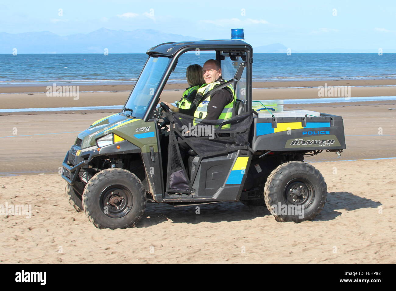 A Polaris Ranger 4x4 operated by Police Scotland, patrols the beach at the Scottish Airshow in 2015. Stock Photo