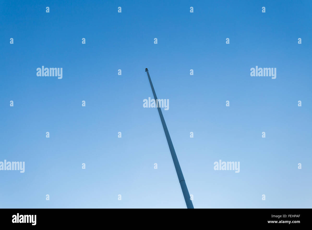 empty flagstaff on blue sky Stock Photo