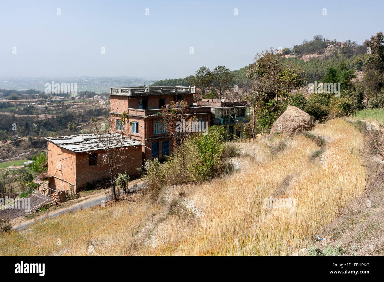 Bhaktapur, Nepal.  Rural House.  Changu Narayan Temple on Hilltop in Distance. Stock Photo