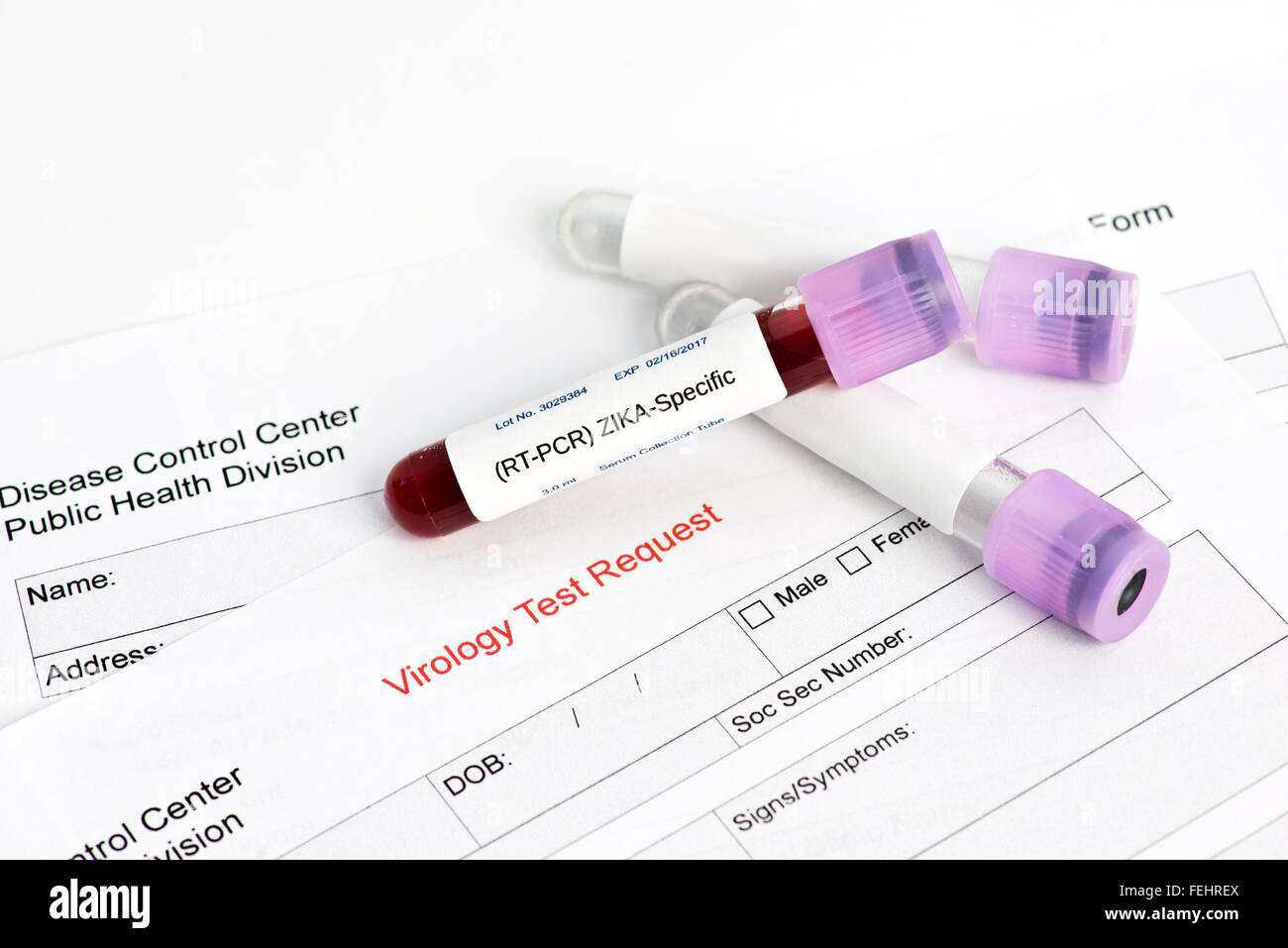 Zika virus blood analysis collection tube with virology lab request.  Labels, document done by photographer and are fake. Stock Photo