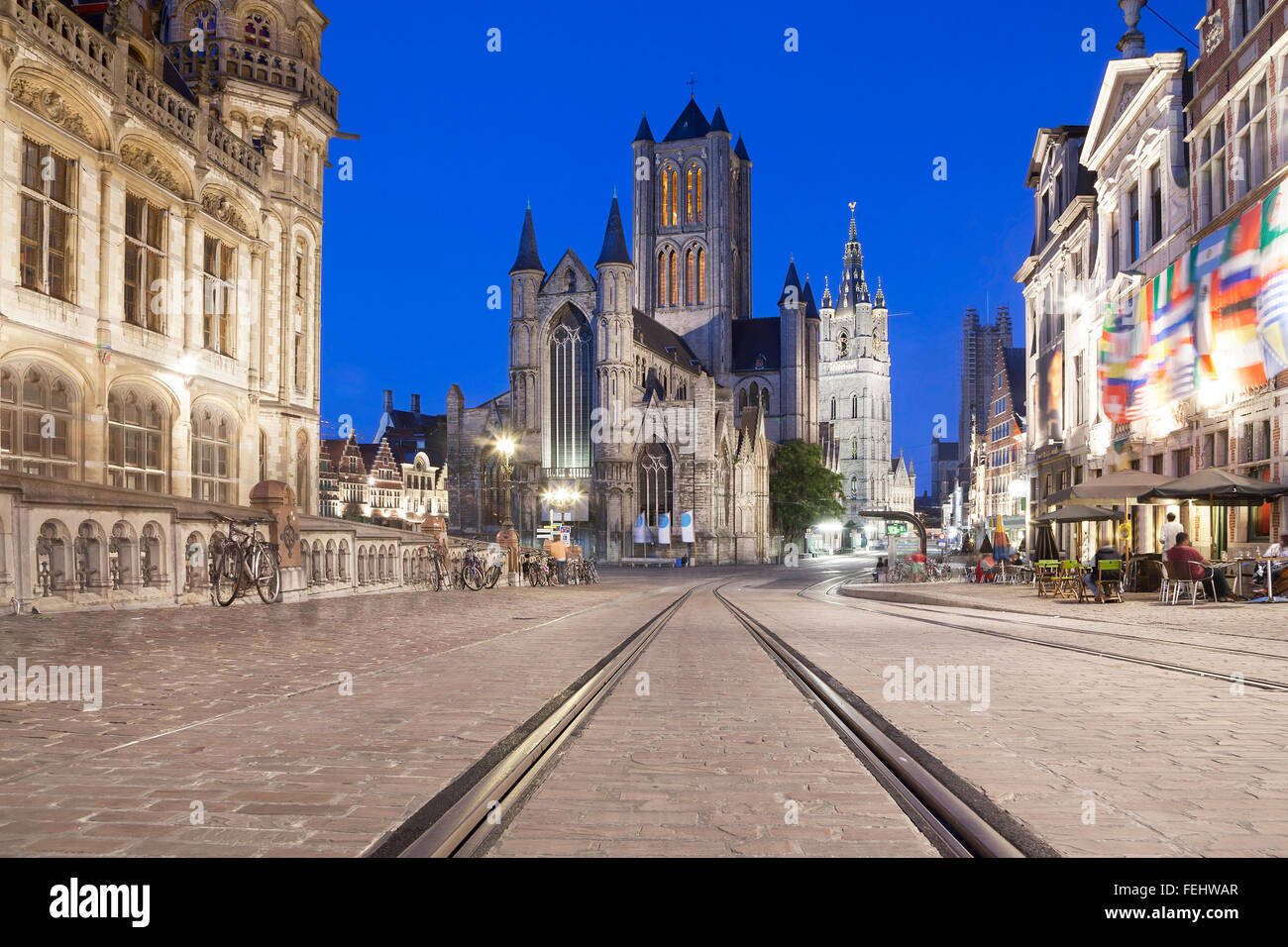 View on Saint Nicholas Church and Belfry of Ghent from Saint Michaels's bridge with tram rails on the foreground Stock Photo