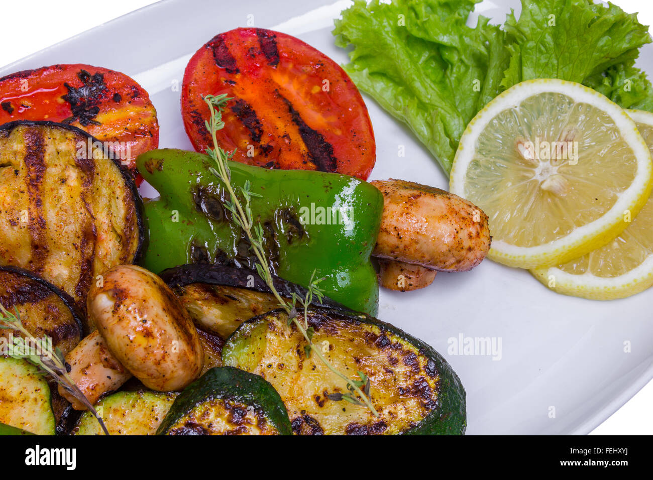 Grilled vegetables on the long white plate, closeup Stock Photo