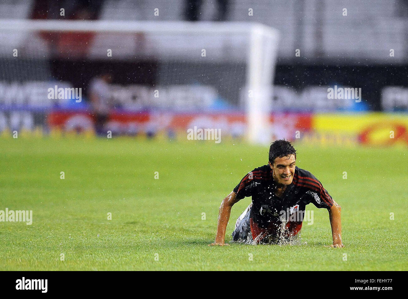 Buenos Aires, Argentina. 7th Feb, 2016. A fan gets in to the playing field before the suspension of the match of the Tornament First Division between River Plate and Quilmes, held at the Antonio Vespuci Monumental Stadium, in the city of Buenos Aires, capital of Argentina, on Feb. 7, 2016. A heavy rain forced the suspension of the match, and it was rescheduled. © Maximiliano Luna/TELAM/Xinhua/Alamy Live News Stock Photo