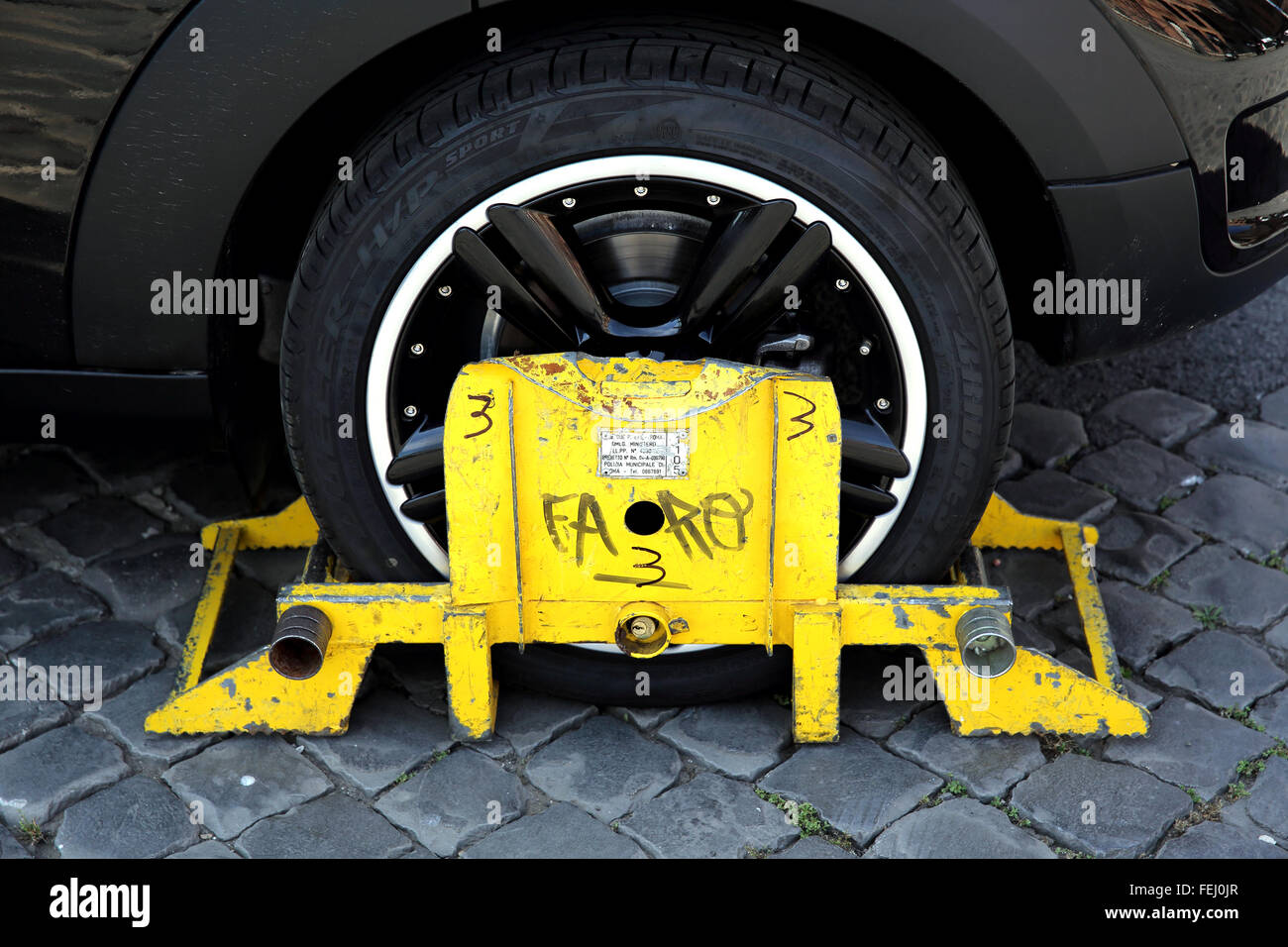 Car wheel clamped in Rome in response to driver parking in prohibited