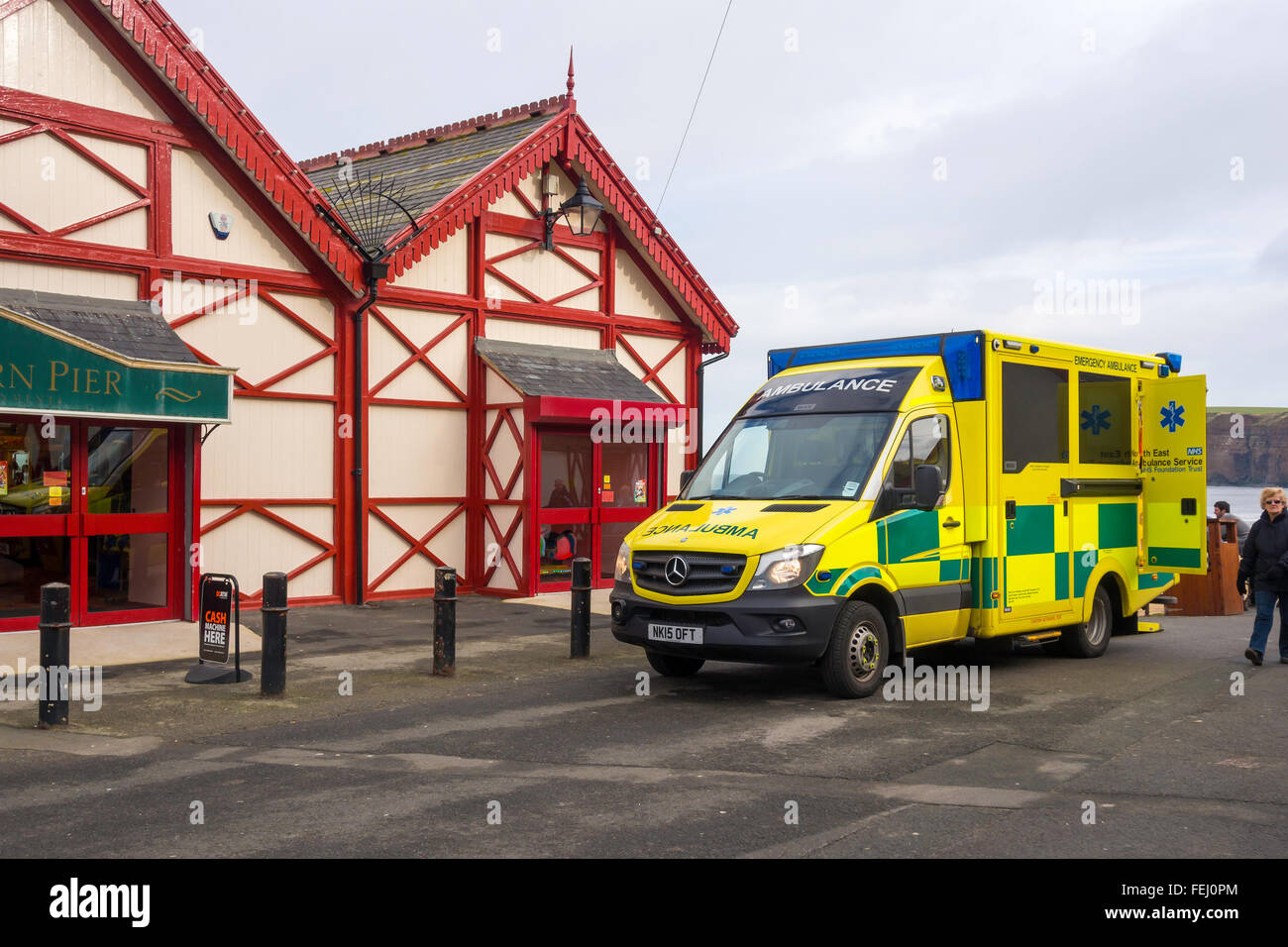 Emergency NHS ambulance on call by the pier at in Whitby UK Stock Photo