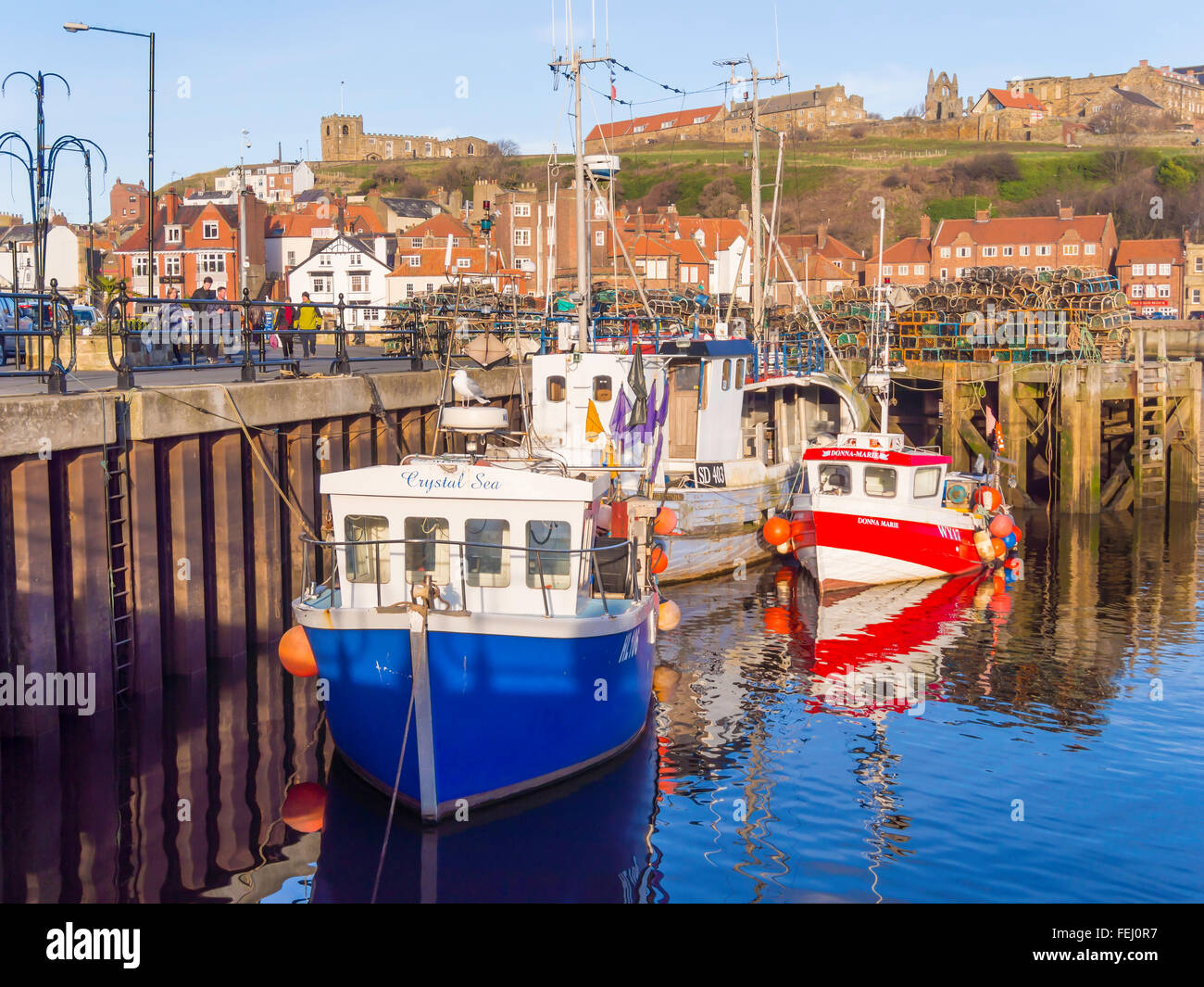 Fishing boats at New Quay Wharf in Whitby harbour North Yorkshire UK Stock Photo