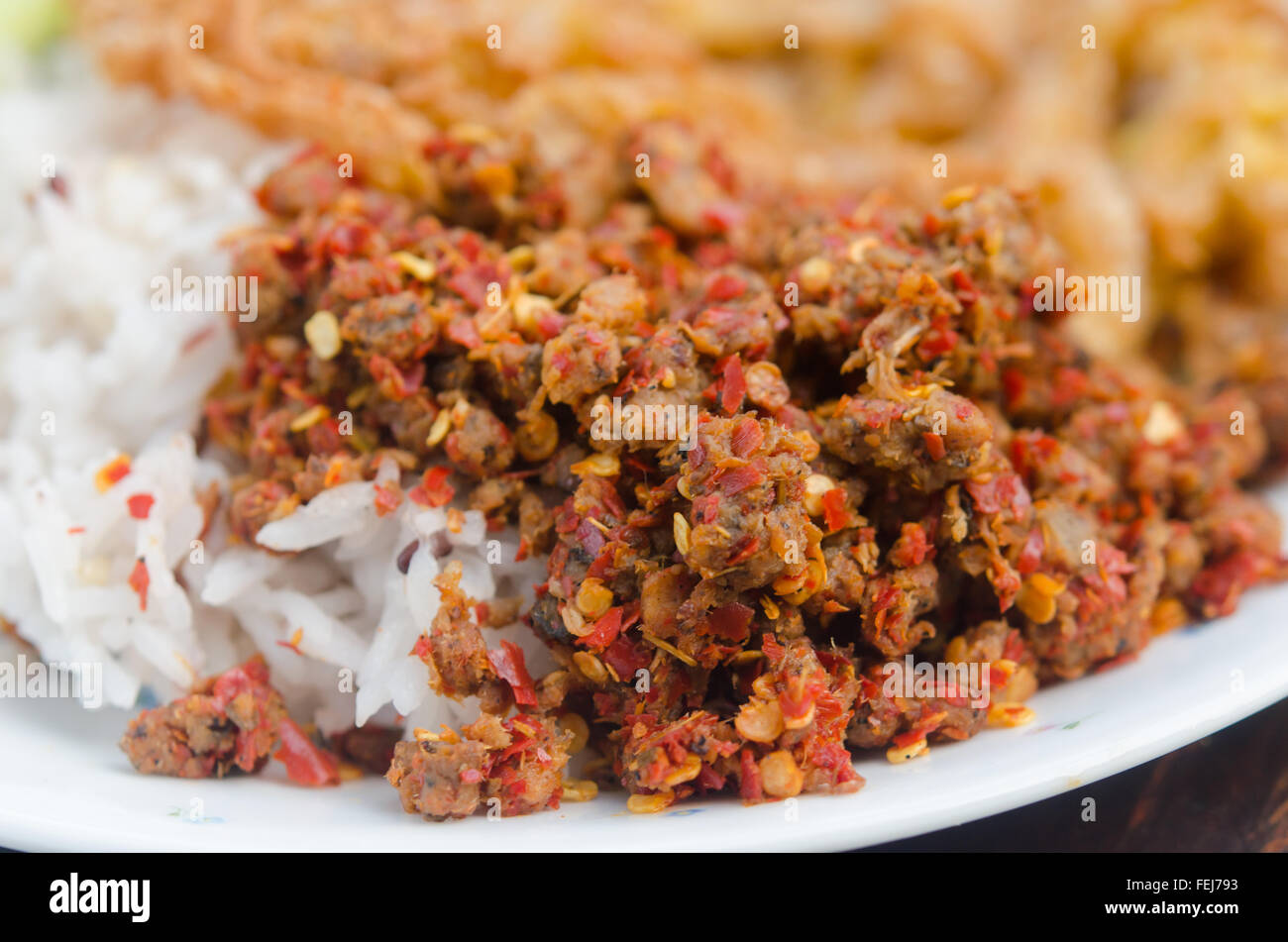 chili paste and rice in dish Stock Photo Alamy