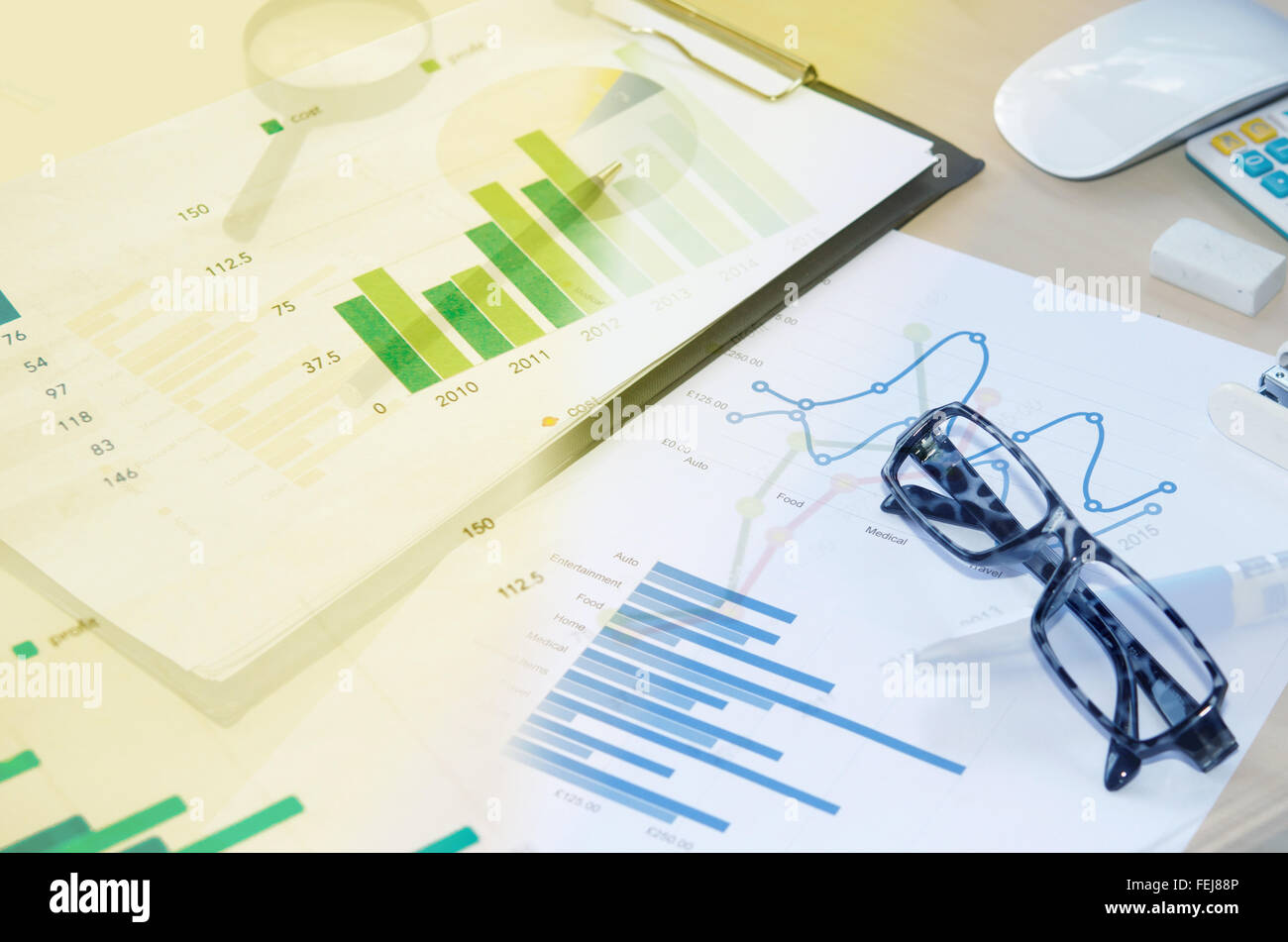 Financial graphs analysis and pen.Business Concept Stock Photo