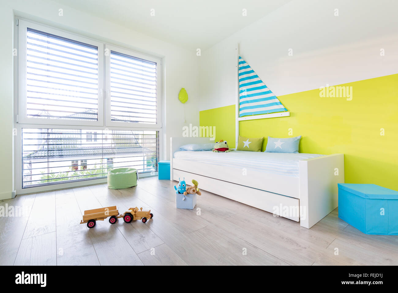 View in Children's playroom with a bed an large window Stock Photo