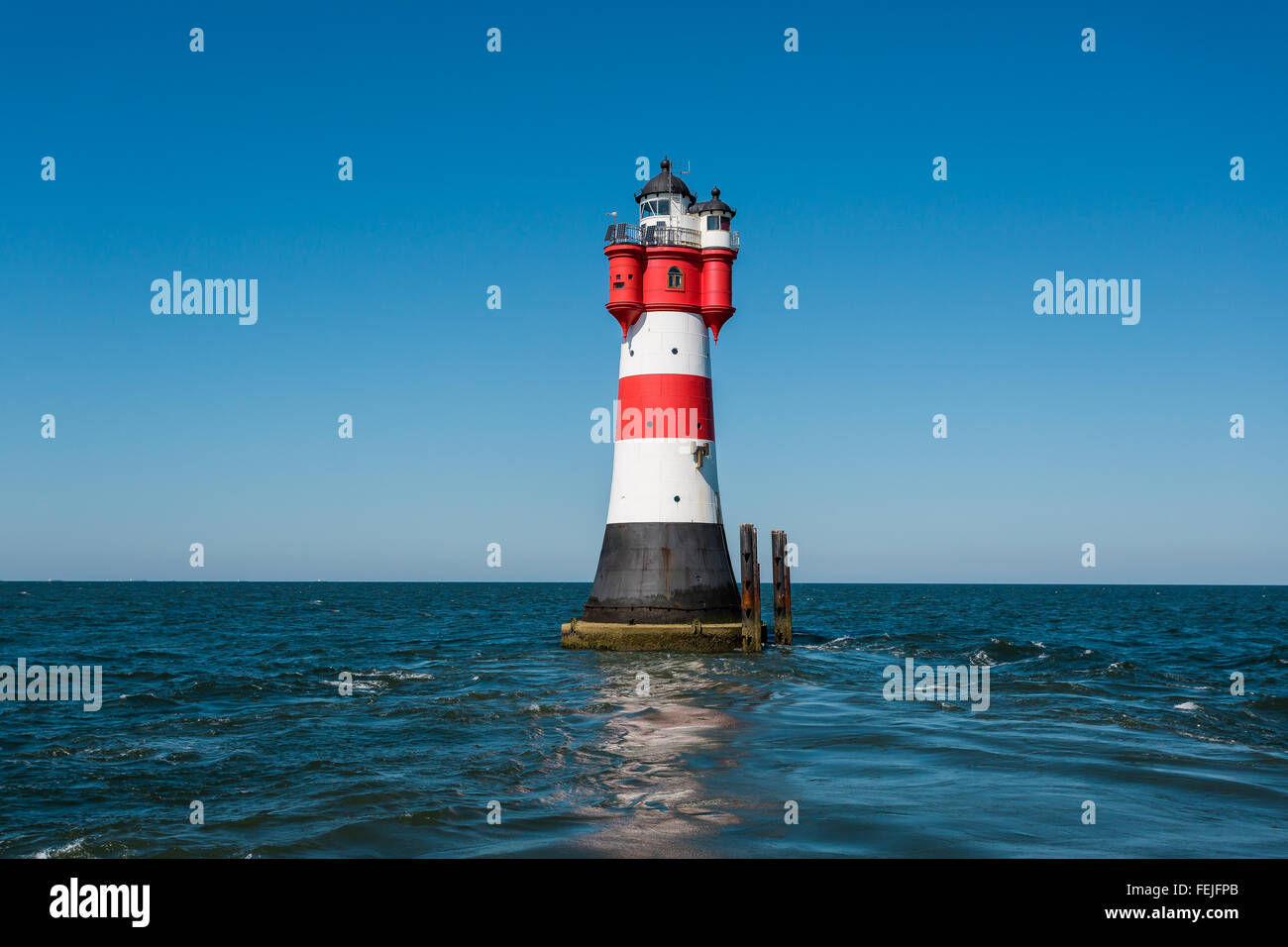 Lighthouse Roter Sand offshore in the north sea Stock Photo