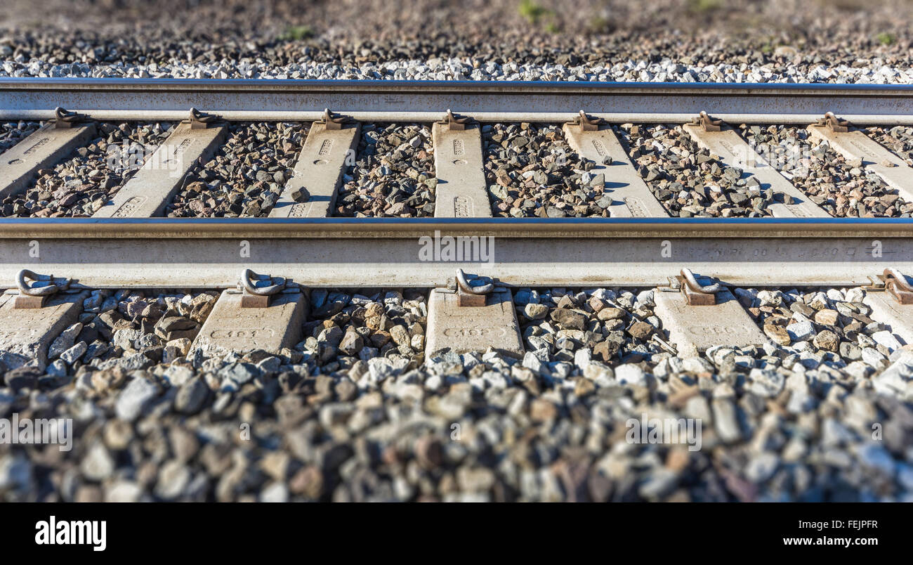 German text Streik (meaning strike) over rusty metal railway tracks and  brackets in a ballast bed, selected focus, narrow depth of field Stock  Photo - Alamy