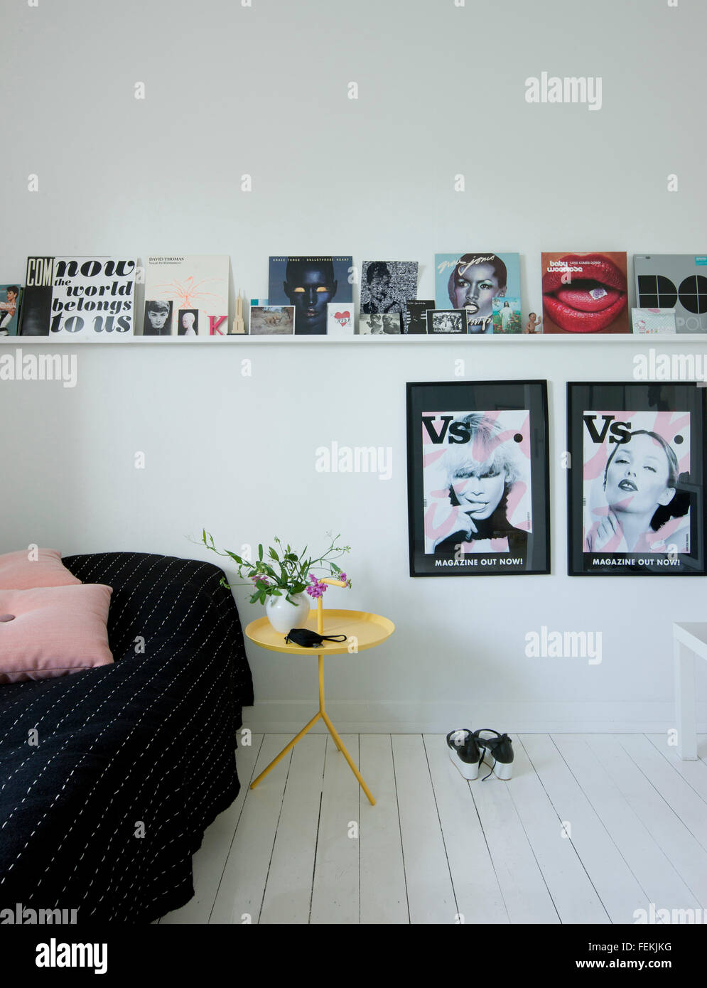 Modernism in the 'Cake House'. A bedroom with white painted floorboards