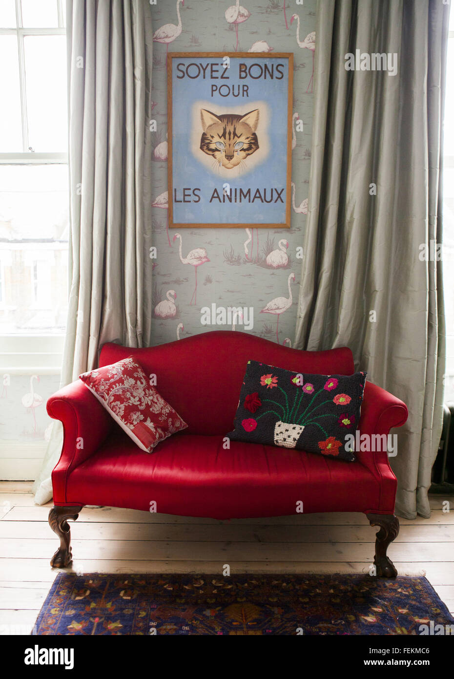 Artist Alice Instone's house in Clapham, London. Detail in upstairs lounge, a red sofa. Stock Photo