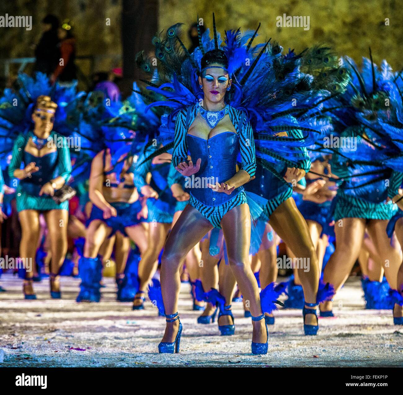 Sitges, Catalonia, Spain. 7th Feb, 2016. Revelers in their colorful costumes  dance in street during the '