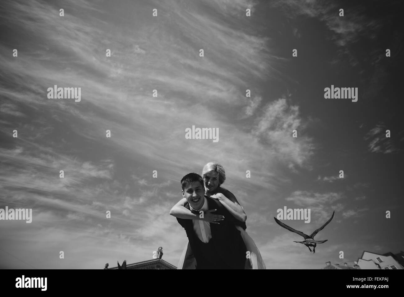elegant stylish happy bride and gorgeous groom on the background of the ...