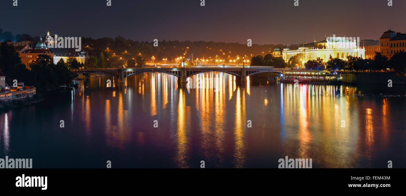 Night Panorama Of Prague, Czech Republic. Panoramic Night View Of Vltava River And Manes Bridge Stock Photo