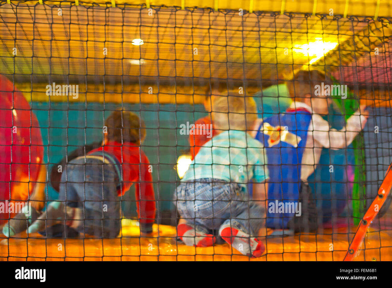 Toddlers playing in a soft play Stock Photo