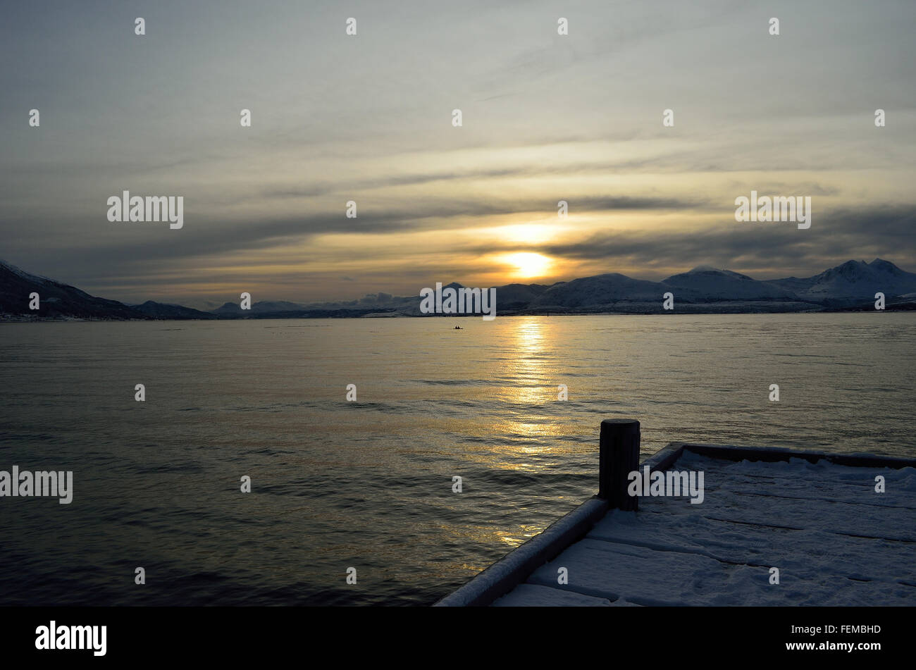 beautiful sunset over snowy mountain and fjord Stock Photo - Alamy