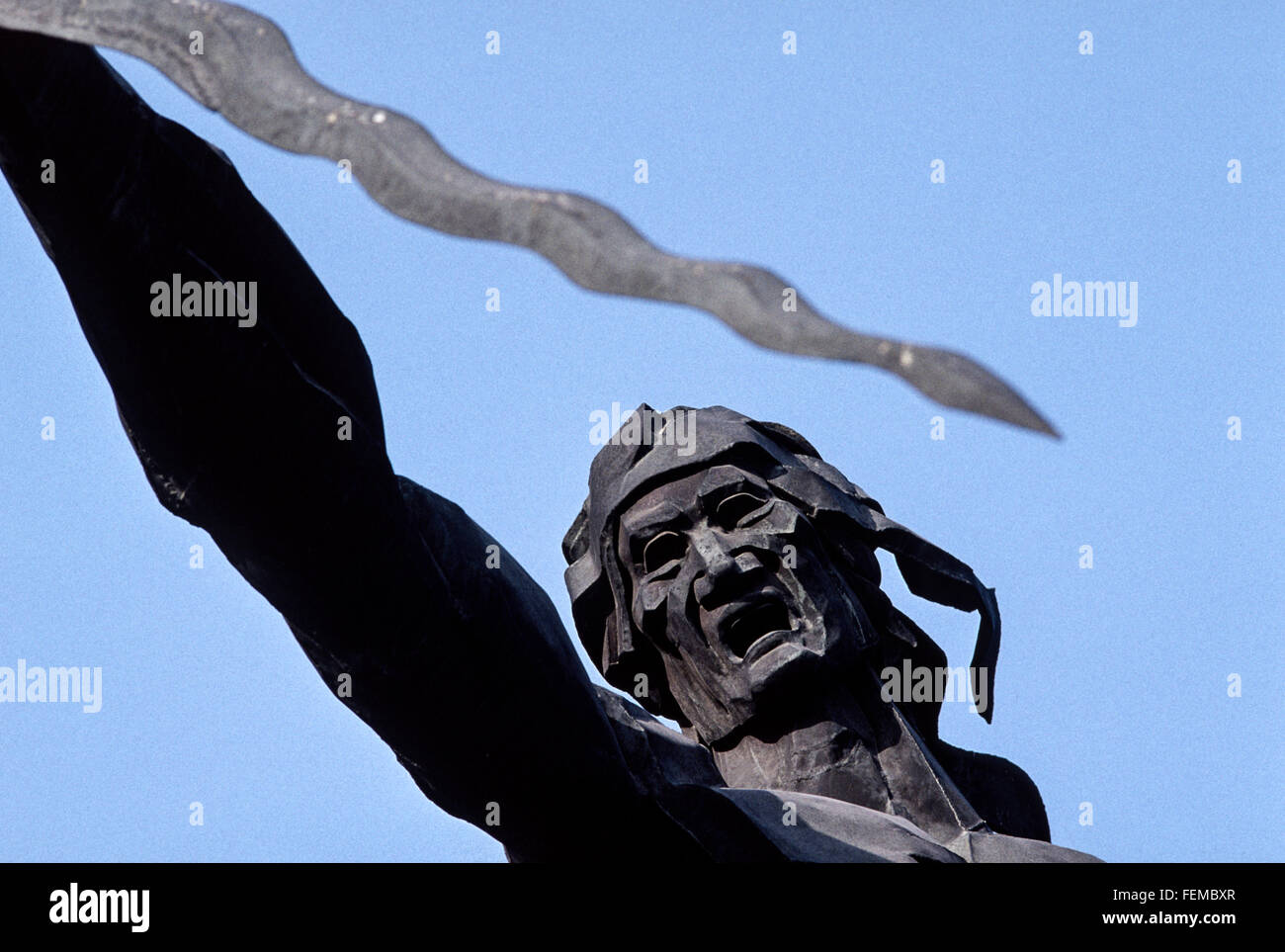 Huge metal statue of Mongolian leader Ghengis Khan holding his sword aloft circa.1930 Stock Photo