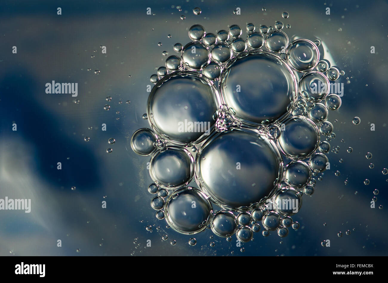 blue abstract bubbles made of oil in water surface Stock Photo - Alamy